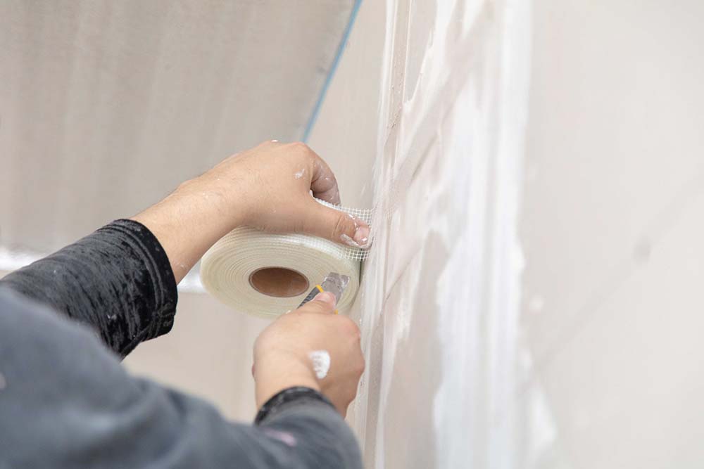 Drywall repairing in process