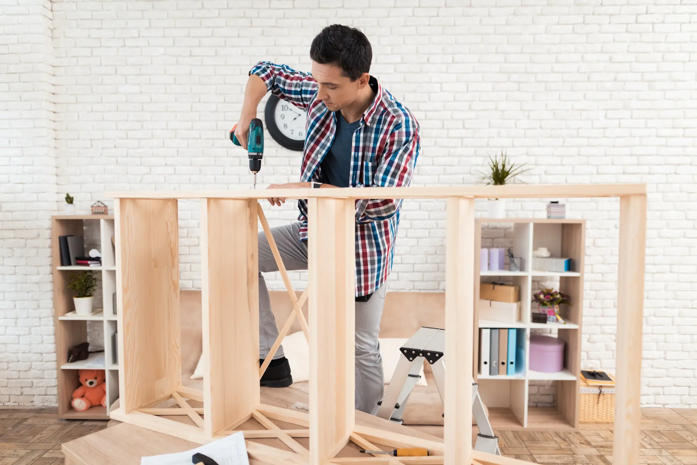 A man is assembling a furniture in winter park fl