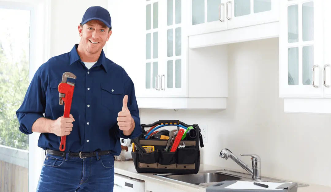 A plumber just performed its work and showing thumbs up