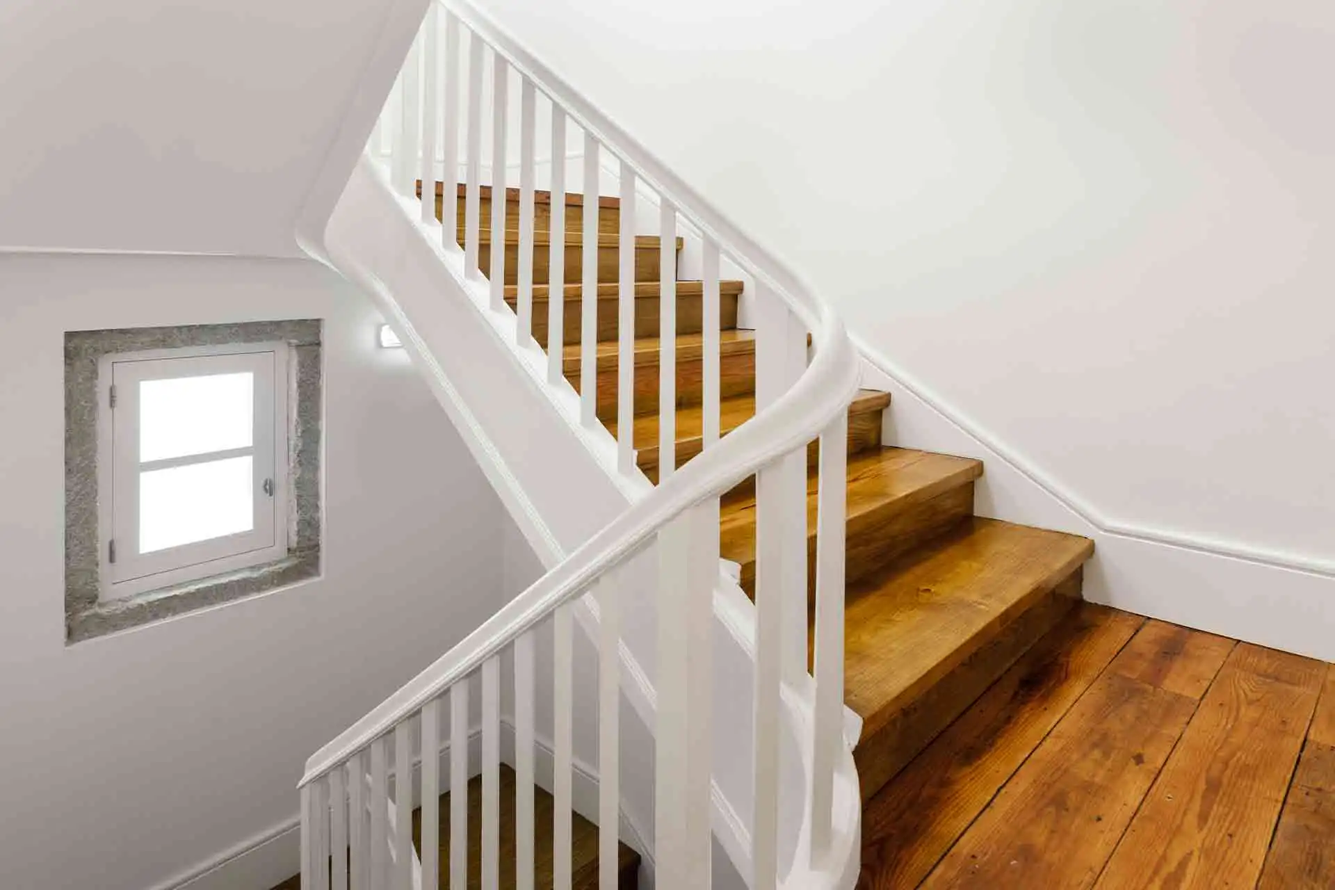 Handrail installation service graphic by TJ Handyman Services featuring a white staircase railing with wooden steps in an Orlando home.